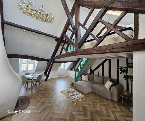 a living room with a couch and a table at La Cathedrale in Senlis