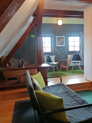 a living room with a couch and a table at Guest House Olšakovský in Český Krumlov