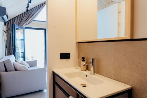 a bathroom with a sink and a mirror at Bay Zatoka Radzyń in Radzyń