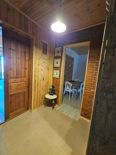 a hallway of a house with a table and a light at Gudaleti Palace Private Countryside Villa near Tbilisi in Kaspi