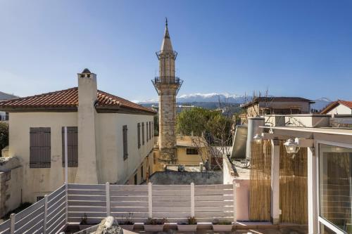 a view of a building with a clock tower at Vetus Oppidum Boutique Guesthouse in Chania