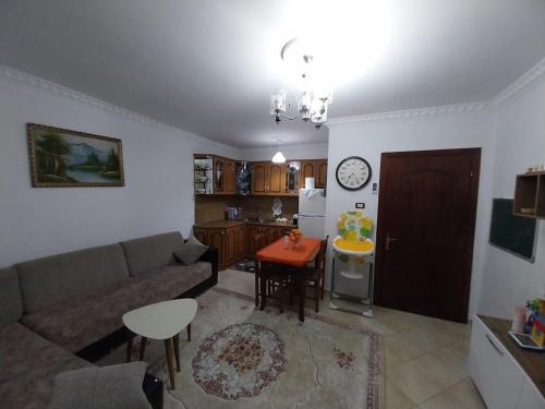 a living room with a couch and a table at Refika in Berat