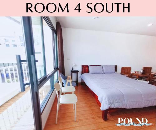 a bedroom with a bed and a room with a balcony at Proud Room &wifi 2 in North Pattaya