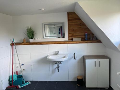 a bathroom with a sink and a mirror at Relaxing in Flachslanden