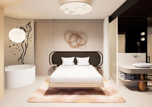 a bedroom with a bed and a tub and a sink at Hotel KUNST in Krško