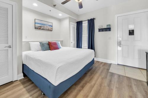 a bedroom with a large bed in a room at Carillon Beach Inn 310 in Panama City Beach