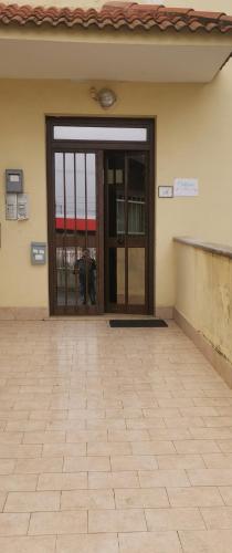 an entrance to a building with a glass door at Catherine Suite in SantʼEufemia Lamezia