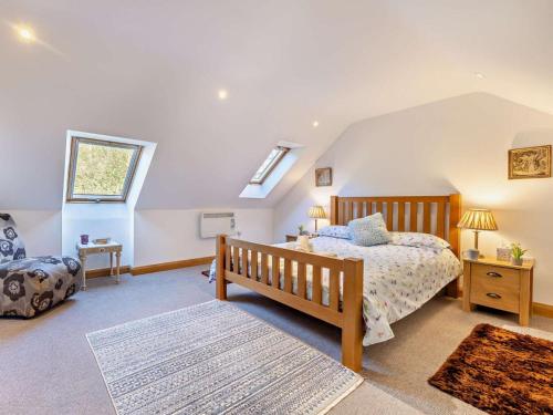 a bedroom with a bed and a skylight at 2 Bed in Arthog oc-43105 in Arthog