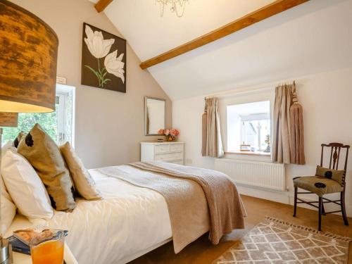 a bedroom with a bed and a window at 1 Bed in Corwen oc-52509 in Corwen