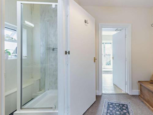 a bathroom with a shower and a bath tub at 1 Bed in Aberaeron oc-49261 in Aberaeron