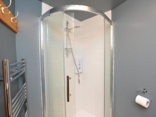 a shower with a glass door in a bathroom at 2 Bed in Presteigne oc-78095 in Presteigne