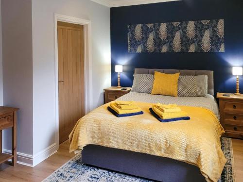 a bedroom with a bed with two towels on it at 1 Bed in Aberdare oc-82906 in Merthyr Tydfil