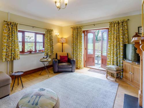 a living room with a couch and a tv at 2 Bed in Clynderwen oc-82445 in Clynderwen