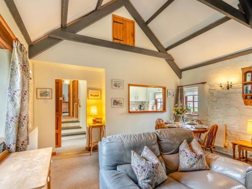 a living room with a couch and a table at 2 Bed in Haverfordwest oc-94123 in Trevine