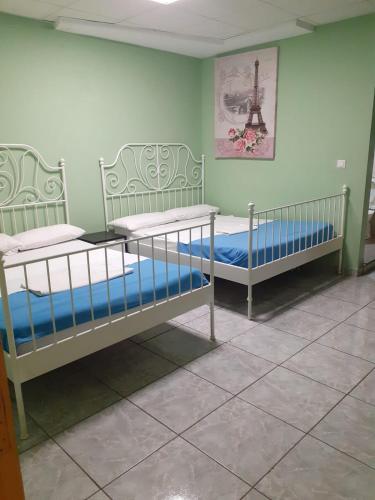 a room with two bunk beds in a room at Tenerife Hostel in Los Cristianos