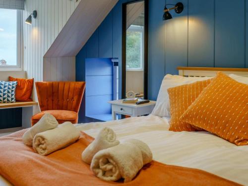 a bedroom with a bed with towels on it at 3 Bed in New Quay oc-83998 in New Quay
