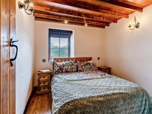a bedroom with a bed and a window at 1 Bed in Swansea oc-74221 in Ilston