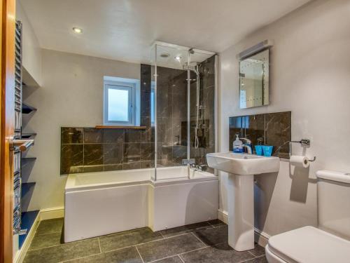 a bathroom with a tub and a sink and a shower at 4 Bed in Newtown oc-48641 in Kerry