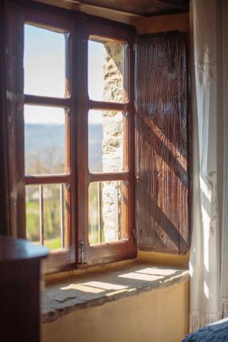 an open window with a view of the ocean at Ca' d'Alfieri in Bardi