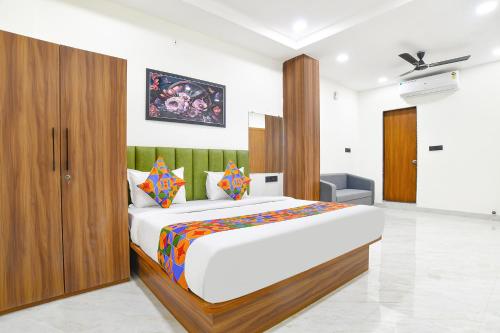 a bedroom with a large bed in a room at FabHotel The Backyard Bowl in Indore