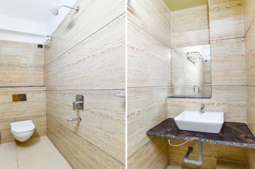 a bathroom with a sink and a toilet at FabHotel The Backyard Bowl in Indore