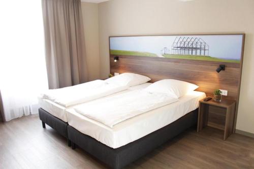 Llit o llits en una habitació de Hotel Dampfmühle