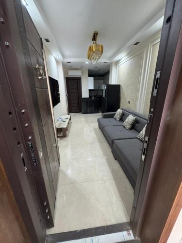 a living room with a couch in the middle of a room at Sharm Glow Villa in Sharm El Sheikh