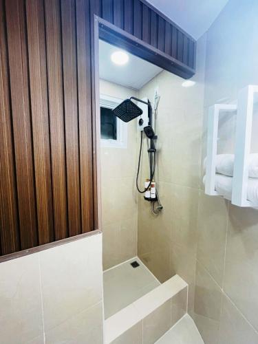 a small bathroom with a shower with a sink at Promesa White House in San Fernando