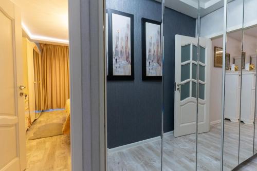 a room with a glass door and a hallway at Complex Rediu 54-PentHouse in Rediu