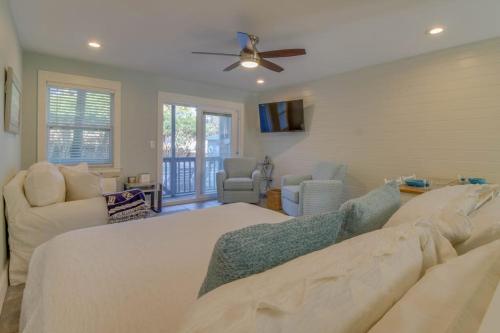 a living room with a large bed and a couch at 104 Inlet Sands Condo in Inlet Beach