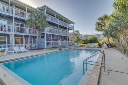 a large swimming pool in front of a building at 104 Inlet Sands Condo in Inlet Beach