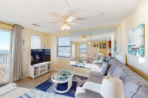 a living room with a couch and a tv at Halsell's Hideaway in Indian Pass