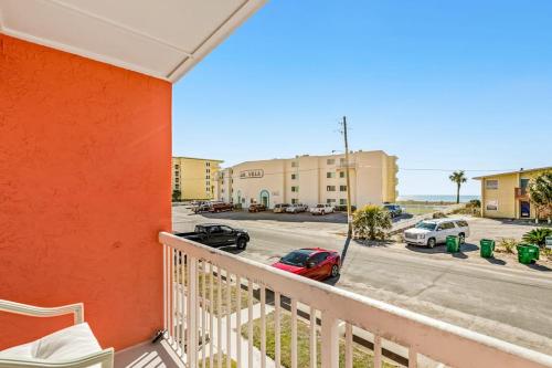 a balcony with a view of a parking lot at Tropical Isle #205 in Fort Walton Beach