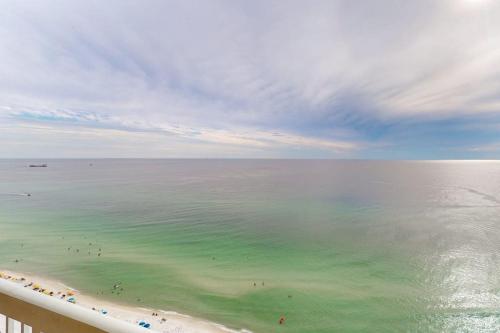 a view of a beach with people in the water at Seychelles Beach Resort 2004 in Panama City Beach