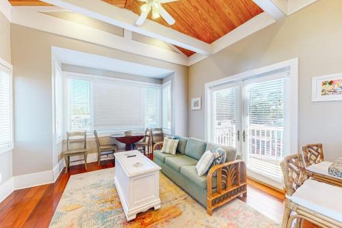 a living room with a couch and a table at Sunshine Haven in Carrabelle