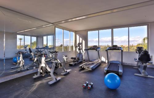 a gym with a bunch of exercise bikes in it at Palais Amador in Oulad Mazoug