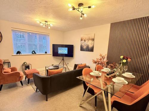 a living room with a couch and a table at No56 - 2-bed Boutique Apartment - Hosted by Hutch Lifestyle in Leamington Spa