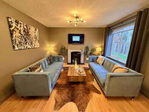 a living room with two couches and a coffee table at No50 - 2-bed Boutique Apartment - Hosted by Hutch Lifestyle in Leamington Spa