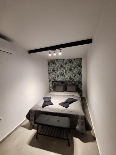 a bedroom with a large bed in a room at Joy's apartment in Markopoulo