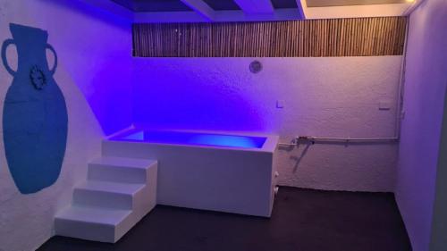 a room with purple lights and stairs in a room at Villa Irini in Kallithea Rhodes
