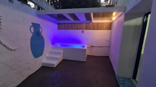 a room with purple lights on a wall at Villa Irini in Kallithea Rhodes