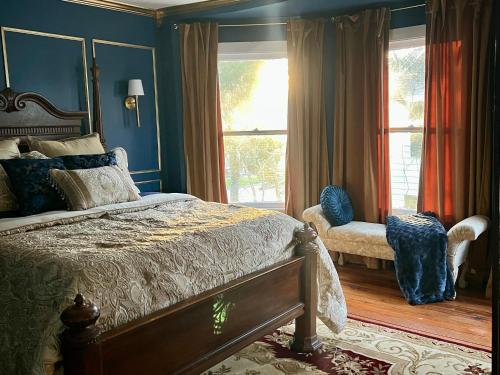 a bedroom with a bed and a window at Ann Street Inn & Garden in Beaufort