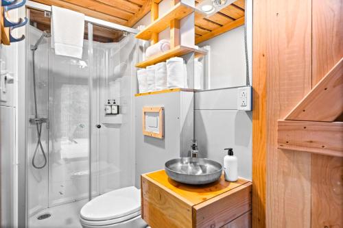 a bathroom with a sink and a shower at Huttopia Berkshires in Hancock