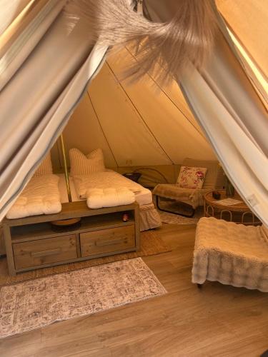 a room with two beds in a tent at Glamping auf dem Weberhof in Münster