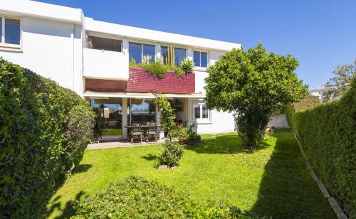 a large white house with a yard at C12 - Sunshine Apartment in Luz in Luz