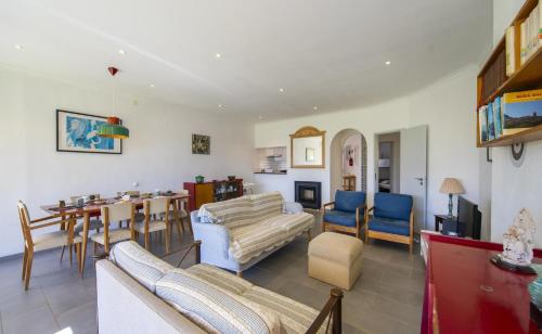 a living room with couches and a dining room at C12 - Sunshine Apartment in Luz in Luz
