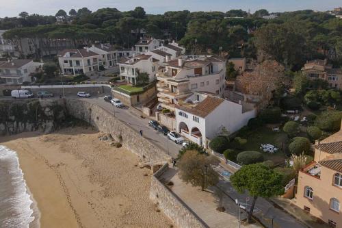 an aerial view of a town with a beach and houses at Terraza al Mar La Fosca in Palamós