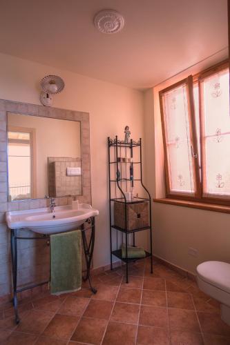 a bathroom with a sink and a mirror at VillaLimone in Limone sul Garda