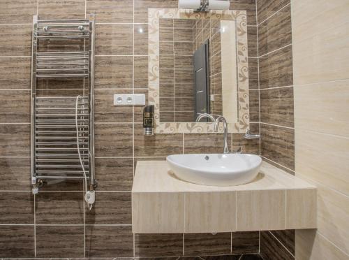 a bathroom with a sink and a mirror at Mattes Restaurant & Pension in Držovice