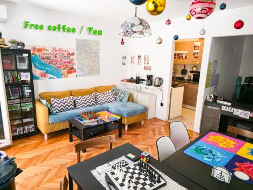 a living room with a couch and a table at Hostel Budva in Budva